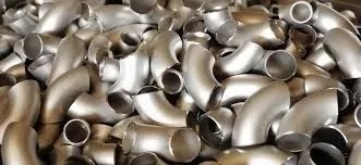 Stainless steel pipe elbows stacked together for smooth flow and reliable piping connections.